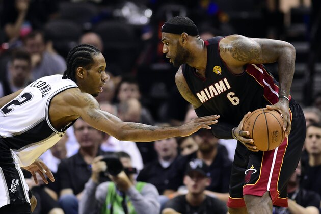 Jun 8, 2014; San Antonio, TX, USA; Miami Heat forward LeBron James (6) handles the ball against San Antonio Spurs forward Kawhi Leonard (2) in game two of the 2014 NBA Finals at AT&T Center. Mandatory Credit: Bob Donnan-USA TODAY Sports