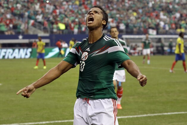 Mexico's Giovani dos Santos (10) celebrates after scoring a goal against Ecuador in the second half of a friendly soccer match Saturday, May 31, 2014, in Arlington, Texas. Mexico won 3-1.  (AP Photo/Tony Gutierrez)