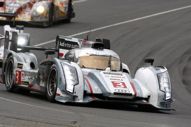 The Audi R18 E-Tron No2 driven by Tom Kristenssen of Denmark turns a corner during the 90th 24-hour Le Mans endurance race, in Le Mans, western France, Sunday, June 23, 2013. (AP Photo/Michel Spingler)