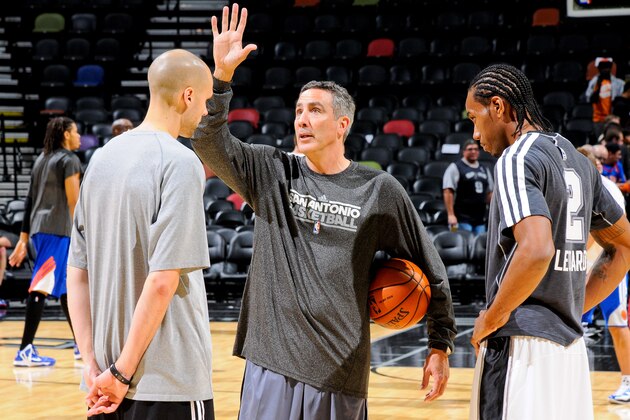 SAN ANTONIO, TX - NOVEMBER 15: Chip Engelland, assistant coach of the San Antonio Spurs, center, speaks with Kawhi Leonard #2 before a game against the New York Knicks on November 15, 2012 at the AT&T Center in San Antonio, Texas. NOTE TO USER: User expressly acknowledges and agrees that, by downloading and or using this photograph, user is consenting to the terms and conditions of the Getty Images License Agreement. Mandatory Copyright Notice: Copyright 2012 NBAE (Photos by D. Clarke Evans/NBAE via Getty Images)