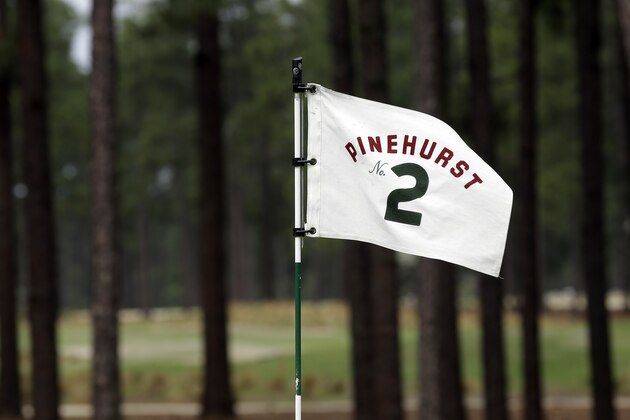 ADVANCE FOR WEEKEND EDITIONS, JUNE 7-8 - FILE - In this April 14, 2014, file photo, a flag on the 10th green blows in the wind at Pinehurst Resort & Country Club’s Course No. 2 in Pinehurst, N.C. The course is considered the masterpiece of Donald Ross, who completed Pinehurst No. 2 in 1907 and continued to refine it until his death in 1948. It has hosted the U.S. Open in 1999 and 2005. (AP Photo/Gerry Broome)
