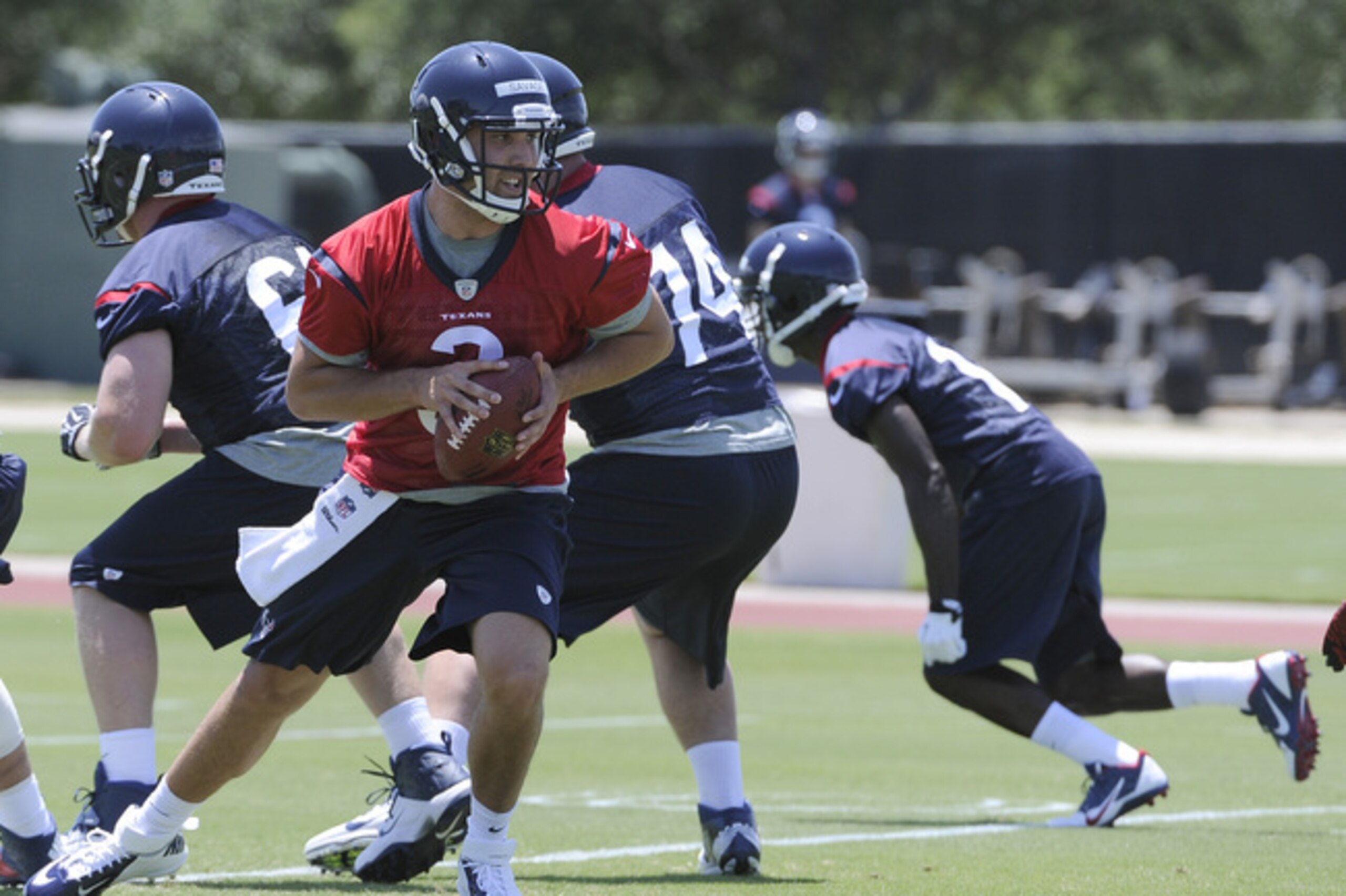 Houston Texans quarterback Tom Savage looks to hand off during a rookie football mini-camp Friday, May 16, 2014, in Houston. (AP Photo/Pat Sullivan)