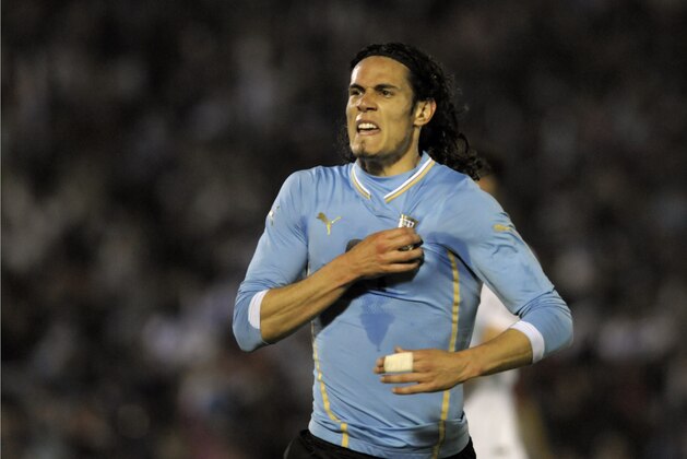 Uruguay's Edinson Cavani celebrates after scoring against  Slovenia during a friendly soccer match in Montevideo, Uruguay, Wednesday, June 4, 2014. (AP Photo/Matilde Campodonico)