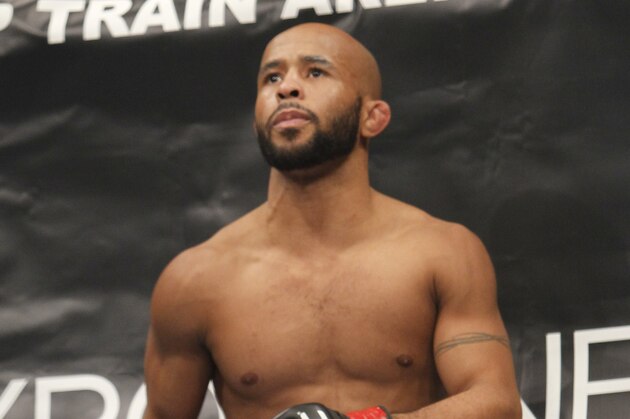 Defending Champion Demetrious Johnson warms up before fighting Joseph Benavidez  for the UFC Flyweight Mixed Martial Arts title in Sacramento, Calif., on Saturday, Dec. 14, 2013.(AP Photo/Steve Yeater)