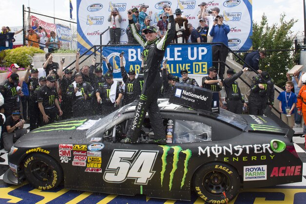 Kyle Busch celebrates in Victory Lane after winning the NASCAR Nationwide series auto race, Saturday, May 31, 2014, at Dover International Speedway in Dover, Del. (AP Photo/Molly Riley)