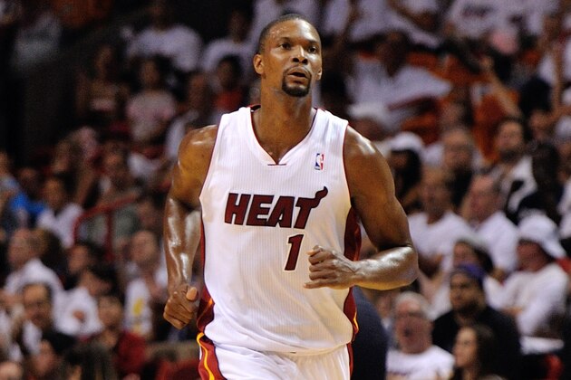 Apr 23, 2014; Miami, FL, USA; Miami Heat center Chris Bosh (1) reacts after making a three point basket against the Charlotte Bobcats in game two during the first round of the 2014 NBA Playoffs at American Airlines Arena. Mandatory Credit: Steve Mitchell-USA TODAY Sports