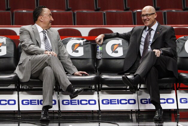 Chicago Bulls general manager Gar Forman, left, and executive vice president of basketball operations John Paxson talk before an NBA basketball game between the Bulls and the Cleveland Cavaliers, Tuesday, Feb. 26, 2013, in Chicago. (AP Photo/Charles Cherney)