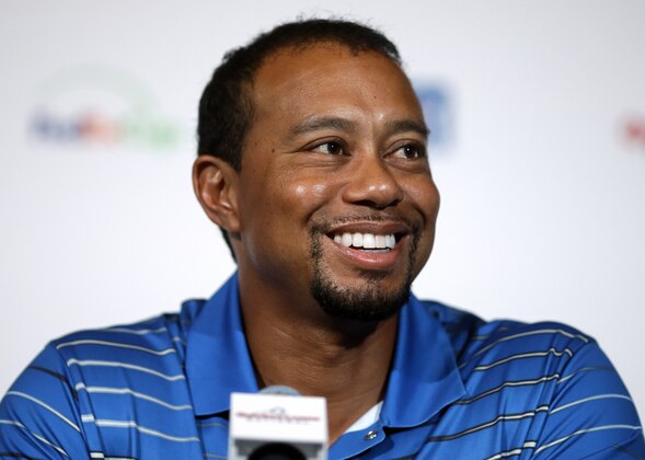 Golfer Tiger Woods speaks at a Quicken Loans National PGA tournament media day news conference at Congressional Country Club, Monday, May 19, 2014, in Bethesda, Md. Woods said his back injury was so debilitating that it caused him to doubt whether he would play golf again. While the surgery he had March 31 erased those doubts, he still has no timetable for his return. (AP Photo/Patrick Semansky)
