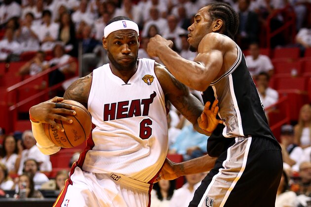 MIAMI, FL - JUNE 10: LeBron James #6 of the Miami Heat drives to the basket against Kawhi Leonard #2 of the San Antonio Spurs during Game Three of the 2014 NBA Finals at American Airlines Arena on June 10, 2014 in Miami, Florida. NOTE TO USER: User expressly acknowledges and agrees that, by downloading and or using this photograph, User is consenting to the terms and conditions of the Getty Images License Agreement.  (Photo by Andy Lyons/Getty Images)