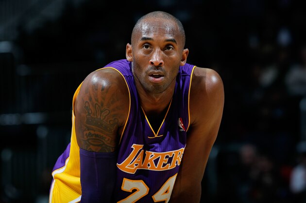 ATLANTA, GA - DECEMBER 16:  Kobe Bryant #24 of the Los Angeles Lakers stands during a free throw against the Atlanta Hawks at Philips Arena on December 16, 2013 in Atlanta, Georgia.  NOTE TO USER: User expressly acknowledges and agrees that, by downloading and or using this photograph, User is consenting to the terms and conditions of the Getty Images License Agreement.  (Photo by Kevin C. Cox/Getty Images)