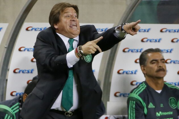 Mexico coach Miguel Herrera gestures to his players during the first half against Bosnia-Herzegovina in an international friendly soccer match at Soldier Field in Chicago, Tuesday, June 3, 2014. (AP Photo/Kamil Krzaczynski)