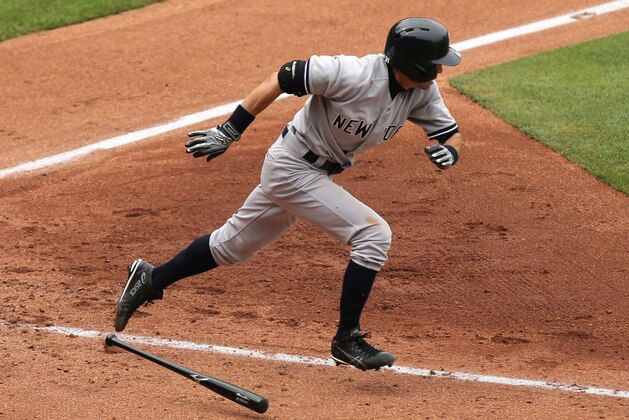 KANSAS CITY, MO - JUNE 8:  Ichiro Suzuki #31 of the New York Yankees runs to first as he grounds out in the sixth inning during a game against the Kansas City Royals at Kauffman Stadium on June 8, 2014 in Kansas City, Missouri. Yangervis Solarte scored on the play. (Photo by Ed Zurga/Getty Images)