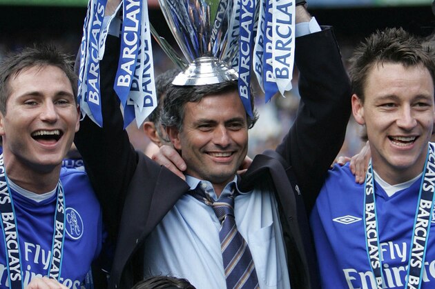 FILE -  A Saturday, May 7, 2005 photo from files showing Chelsea FC manager Jose Mourinho celebrating the FA Premiership trophy with Frank Lampard, left, and John Terry, after winning the English Premiership League at Stamford Bridge in London.  Jose Mourinho is officially returning to Chelsea as the London club's new manager, six years after his acrimonious departure. Chelsea confirmed Monday, June 3, 2013 that the 50-year-old Mourinho was hired on a four-year contract after completing a three-year stint at Real Madrid, where his final season ended without a trophy. Madrid released the Portuguese coach from his contract a year early, so Chelsea owner Roman Abramovich will not have to pay compensation to be re-united with the manager he fell out with in 2007. (AP Photo/Alastair Grant, File)