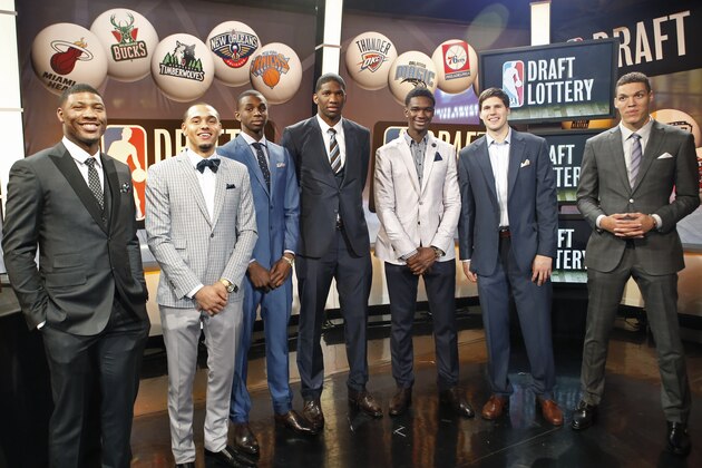 From left, NBA draft prospects Marcus Smart of Oklahoma State, Tyler Ennis of Syracuse, Andrew Wiggins and Joel Embiid of Kansas, Noah Vonleh of Indiana, Doug McDermott of Creighton and Aaron Gordon of Arizona pose for a photograph before the NBA basketball draft lottery in New York, Tuesday, May 20, 2014. (AP Photo/Kathy Willens)