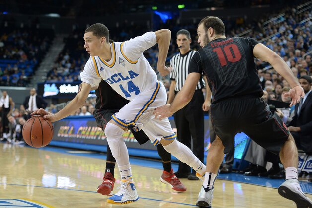 LOS ANGELES, CA - JANUARY 23:  Zach LaVine #14 of the UCLA Bruins dribbles past Robbie Lemons #10 of the Stanford Cardinal during a 91-74 UCLA win at Pauley Pavilion on January 23, 2014 in Los Angeles, California.  (Photo by Harry How/Getty Images)