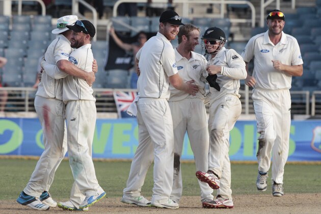 New Zealand's cricket player celebrate on the pitch at the end of their first cricket Test match against West Indies in Kingston, Jamaica, Wednesday, June 11, 2014. Zealand won by 186 runs (AP Photo/Arnulfo Franco)