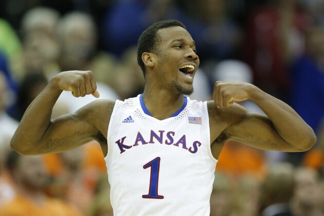 Kansas guard Wayne Selden, Jr. celebrates following an NCAA college basketball game against Oklahoma State in the quarterfinals of the Big 12 Conference men's tournament in Kansas City, Mo., Thursday, March 13, 2014. Kansas defeated Oklahoma State 77-70 in overtime. (AP Photo/Orlin Wagner)