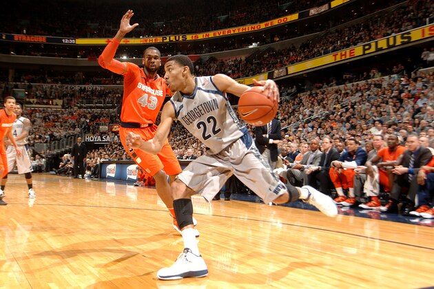 WASHINGTON, DC - MARCH 9:  Otto Porter Jr. #22 of the Georgetown Hoyas dribbles by James Southerland #43 of the Syracuse Orange during a college basketball game on March 9, 2013 at the Verizon Center in Washington, DC.  The Hoyas won 61-39.  (Photo by Mitchell Layton/Getty Images)