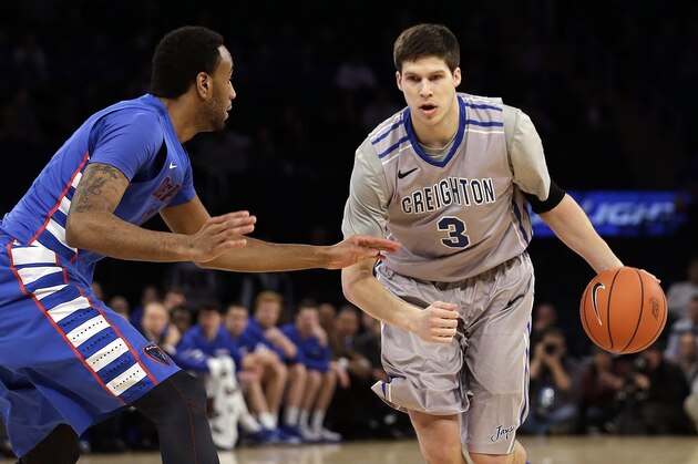 DePaul's Forrest Robinson, left, defends against Creighton's Doug McDermott (3) during the first half of an NCAA college basketball game in the quarterfinals of the Big East Conference tournament on Thursday, March 13, 2014, at Madison Square Garden in New York. (AP Photo/Frank Franklin II)