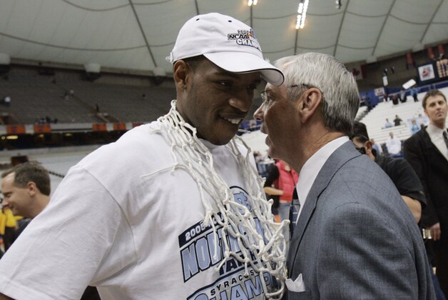 File- This March 27, 2005, file photo shows North Carolina coach Roy Williams chatting with Rashad McCants after defeating Wisconsin 88-82 to win the NCAA East Regional in Syracuse, N.Y.  Williams denied allegations of academic wrongdoing Friday, June 6, 2014, by former player McCants connected to the school’s long-running academic scandal. In an interview with ESPN’s “Outside the Lines” to air Friday, McCants, the second-leading scorer on Williams’ first NCAA championship team in 2005, said tutors wrote papers for him and that Williams knew about no-show classes popular with athletes.  (AP Photo/David Duprey, File)