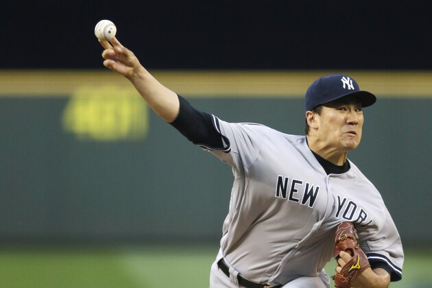 New York Yankees starting pitcher Masahiro Tanaka throws against the Seattle Mariners in the fourth inning of a baseball game, Wednesday, June 11, 2014, in Seattle. (AP Photo/Ted S. Warren)