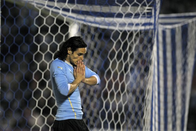 Uruguay's Edinson Cavani gestures during a friendly soccer match against Slovenia in Montevideo, Uruguay, Wednesday, June 4, 2014. (AP Photo/Matilde Campodonico)