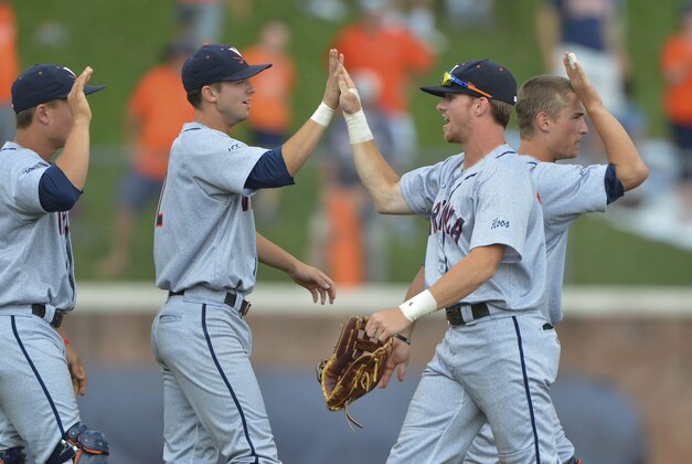 Jun 8, 2014; Charlottesville, VA, USA; Virginia Cavaliers  celebrates on the field after defeating the Maryland Terps 7-3 in the NCAA College baseball super regionals at at Davenport  Field . Mandatory Credit: Tommy Gilligan-USA TODAY Sports