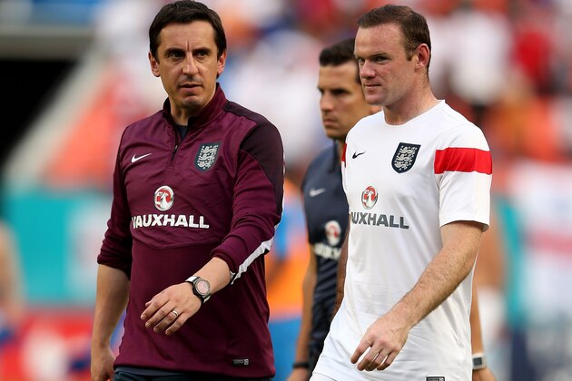 MIAMI GARDENS, FL - JUNE 07:  Wayne Rooney and assistant coach Gary Neville of England walk off at the end of the International Friendly match between England and Honduras at the Sun Life Stadium on June 7, 2014 in Miami Gardens, Florida.  (Photo by Richard Heathcote/Getty Images)