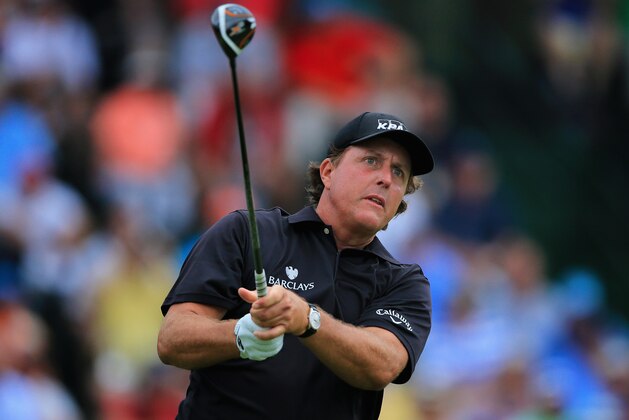 PINEHURST, NC - JUNE 12:  Phil Mickelson of the United States watches his tee shot on the 13th hole during the first round of the 114th U.S. Open at Pinehurst Resort & Country Club, Course No. 2 on June 12, 2014 in Pinehurst, North Carolina.  (Photo by David Cannon/Getty Images)