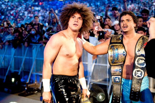 Wrestlers Carlito, right, and Bobby Lashley, left, of World Wrestling Entertainment pose after a news conference at Madison Square Garden Tuesday, Nov. 21, 2006 in New York. Armed Forces Entertainment has invited WWE to perform a series of wrestling matches for U.S. troops based in Iraq. (AP Photo/Frank Franklin II)