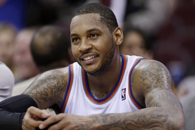 New York Knicks' Carmelo Anthony smiles during the fourth quarter of an NBA basketball game against the Cleveland Cavaliers Saturday, March 8, 2014, in Cleveland. (AP Photo/Tony Dejak)