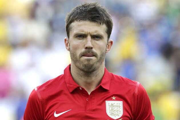 England's Michael Carrick stands during the playing of the British national anthem before the start of an international soccer friendly against Brazil at the Maracana stadium in Rio de Janeiro, Brazil,  Sunday, June 2, 2013. (AP Photo/Victor R. Caivano)