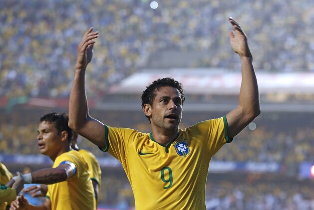 Brazil's Fred celebrates his goal against Serbia at a friendly soccer match at Morumbi stadium in Sao Paulo, Brazil, Friday, June 6, 2014. Brazil is hosting the World Cup soccer tournament that starts June 12. (AP Photo/Andre Penner)