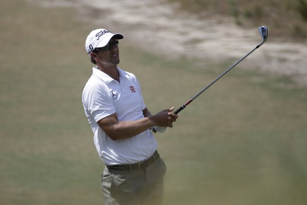 Adam Scott, of Australia, hits out of the bunker on the sixth hole during a practice round for the U.S. Open golf tournament in Pinehurst, N.C., Wednesday, June 11, 2014. The tournament starts Thursday. (AP Photo/Eric Gay)