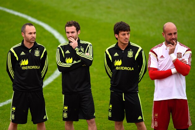 CURITIBA, BRAZIL - JUNE 10:  (L-R) Andres Iniesta, Juan Mata, David Silva and Pepe Reina of Spain look on during a Spain training session at the Centro de Entrenamiento do Caju on June 10, 2014 in Curitiba, Brazil.  (Photo by David Ramos/Getty Images)
