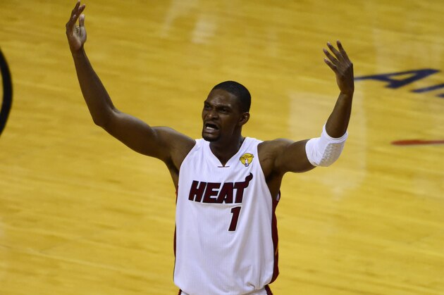 Jun 10, 2014; Miami, FL, USA; Miami Heat center Chris Bosh (1) reacts after shooting a three-pointer against the San Antonio Spurs during the second half of game three of the 2014 NBA Finals at American Airlines Arena. Mandatory Credit: Bob Donnan-USA TODAY Sports