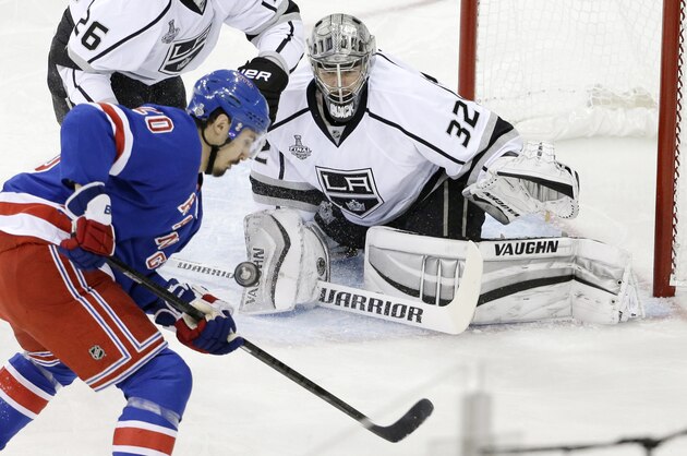 New York Rangers left wing Chris Kreider (20) looks to score against Los Angeles Kings goalie Jonathan Quick (32) in the first period during Game 4 of the NHL hockey Stanley Cup Final, Wednesday, June 11, 2014, in New York. (AP Photo/Frank Franklin II)