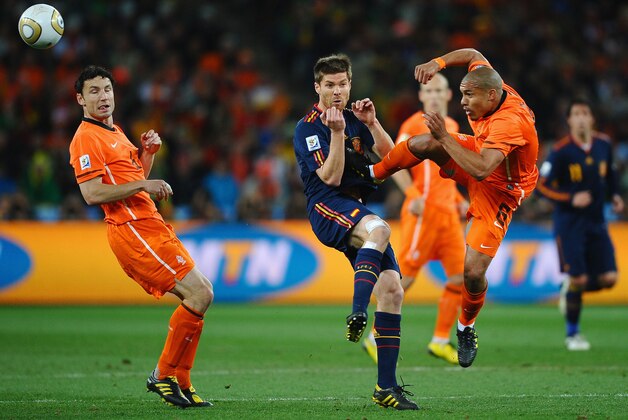 JOHANNESBURG, SOUTH AFRICA - JULY 11:  Nigel De Jong of the Netherlands tackles Xabi Alonso of Spain with a kick in the chest during the 2010 FIFA World Cup South Africa Final match between Netherlands and Spain at Soccer City Stadium on July 11, 2010 in Johannesburg, South Africa.  (Photo by Laurence Griffiths/Getty Images)