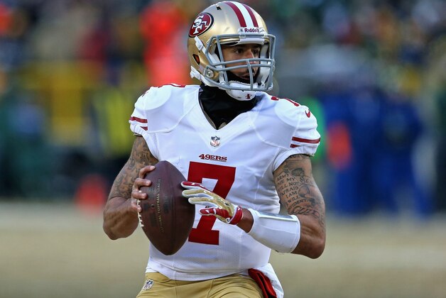 GREEN BAY, WI - JANUARY 05:  Colin Kaepernick #7 of the San Francisco 49ers rolls out to look for a receiver against the Green Bay Packers during an NFC Wild Card Playoff game at Lambeau Field on January 5, 2014 in Green Bay, Wisconsin. The 49ers defeated the Packers 23-20.  (Photo by Jonathan Daniel/Getty Images)