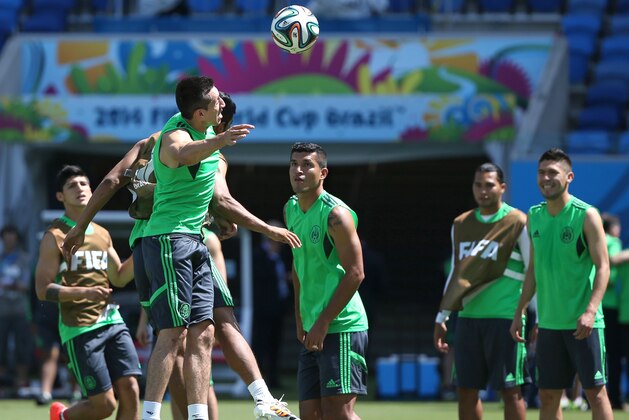 Mexico's soccer players train for the World Cup at the Arena das Dunas stadium in Natal, Brazil, Thursday, June 12, 2014. (AP Photo/Sergei Grits)