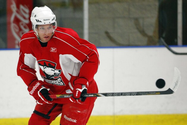 Zach Boychuk reaches for a puck during the opening hockey practice of the Charlotte Checkers training camp in Indian Trail, N.C., Saturday, Sept. 29, 2012. Several Carolina Hurricanes players are training with the Checkers, their AHL affiliate team, during the NHL lockout. (AP Photo/Chuck Burton)