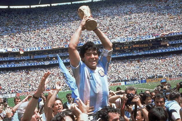 Diego Maradona of Argentina celebrates with the cup at the end of the World Cup soccer final in the Atzeca Stadium, in Mexico City, Mexico, on June 29, 1986. Argentina defeated West Germany 3-2 to take the trophy. (Ap Photo/Carlo Fumagalli)