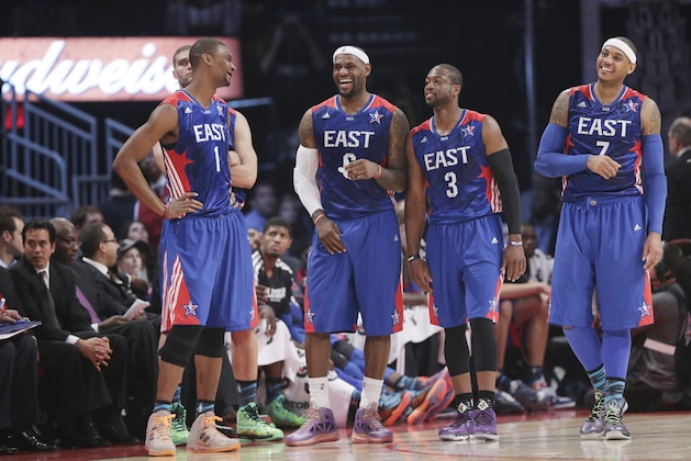 From left, East Team's Chris Bosh of the Miami Heat, LeBron James of the Miami Heat, Dwyane Wade of the Miami Heat and Carmelo Anthony of the New York Knicks share a moment during the first half of the NBA All-Star basketball game against the West Team Sunday, Feb. 17, 2013, in Houston. (AP Photo/Eric Gay)