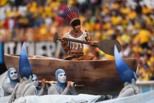 SAO PAULO, BRAZIL - JUNE 12: A performer is carried in a boat during the Opening Ceremony of the 2014 FIFA World Cup Brazil prior to the Group A match between Brazil and Croatia at Arena de Sao Paulo on June 12, 2014 in Sao Paulo, Brazil.  (Photo by Buda Mendes/Getty Images)
