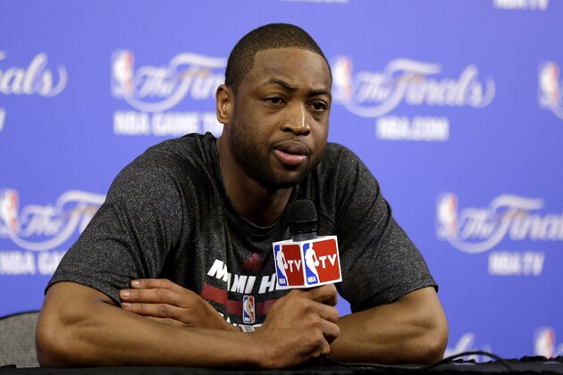 Miami Heat's Dwyane Wade listens to questions during an NBA basketball media availability at the NBA Finals, Wednesday, June 11, 2014, in Miami. The San Antonio Spurs lead the Heat 2-1 in the best-of-seven games series. (AP Photo/Lynne Sladky)
