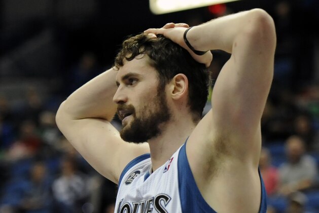 Minnesota Timberwolves forward Kevin Love (42) reacts in an NBA basketball game against the San Antonio Spurs at the Target Center on in Minneapolis on Tuesday, April 8, 2014. (AP Photo/Hannah Foslien)