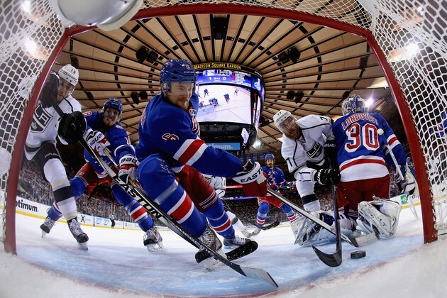 NEW YORK, NY - JUNE 11:  Anton Stralman #6 of the New York Rangers defends the puck from Jeff Carter #77 of the Los Angeles Kings during the first period of Game Four of the 2014 NHL Stanley Cup Final at Madison Square Garden on June 11, 2014 in New York, New York.  (Photo by Bruce Bennett/Getty Images)