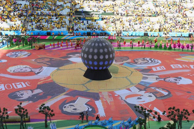 SAO PAULO, BRAZIL - JUNE 12: The Happiness Flag is seen as artists perform during the Opening Ceremony of the 2014 FIFA World Cup Brazil prior to the Group A match between Brazil and Croatia at Arena de Sao Paulo on June 12, 2014 in Sao Paulo, Brazil.  (Photo by Elsa/Getty Images)