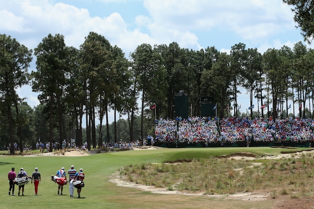 PINEHURST, NC - JUNE 12:  Webb Simpson of the United States, Rory McIlroy of Northern Ireland and Graeme McDowell of Northern Ireland walk to the 17th green with their caddies during the first round of the 114th U.S. Open at Pinehurst Resort & Country Club, Course No. 2 on June 12, 2014 in Pinehurst, North Carolina.  (Photo by Andrew Redington/Getty Images)