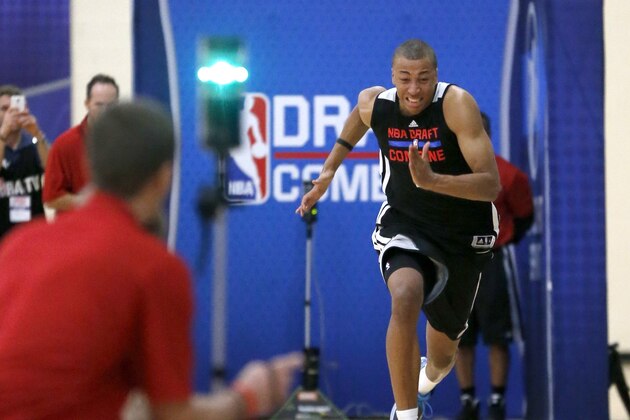 Dante Exum, from Australia, participates in the three-quarters-court sprint in the 2014 NBA basketball draft combine Friday, May 16, 2014, in Chicago. (AP Photo/Charles Rex Arbogast)